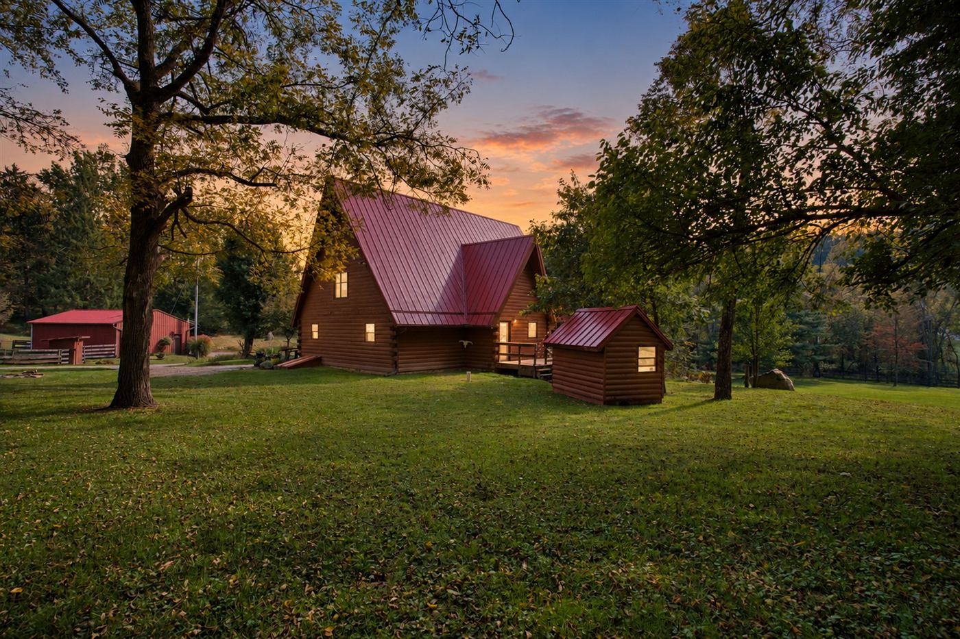 Log home at dusk across the lawn