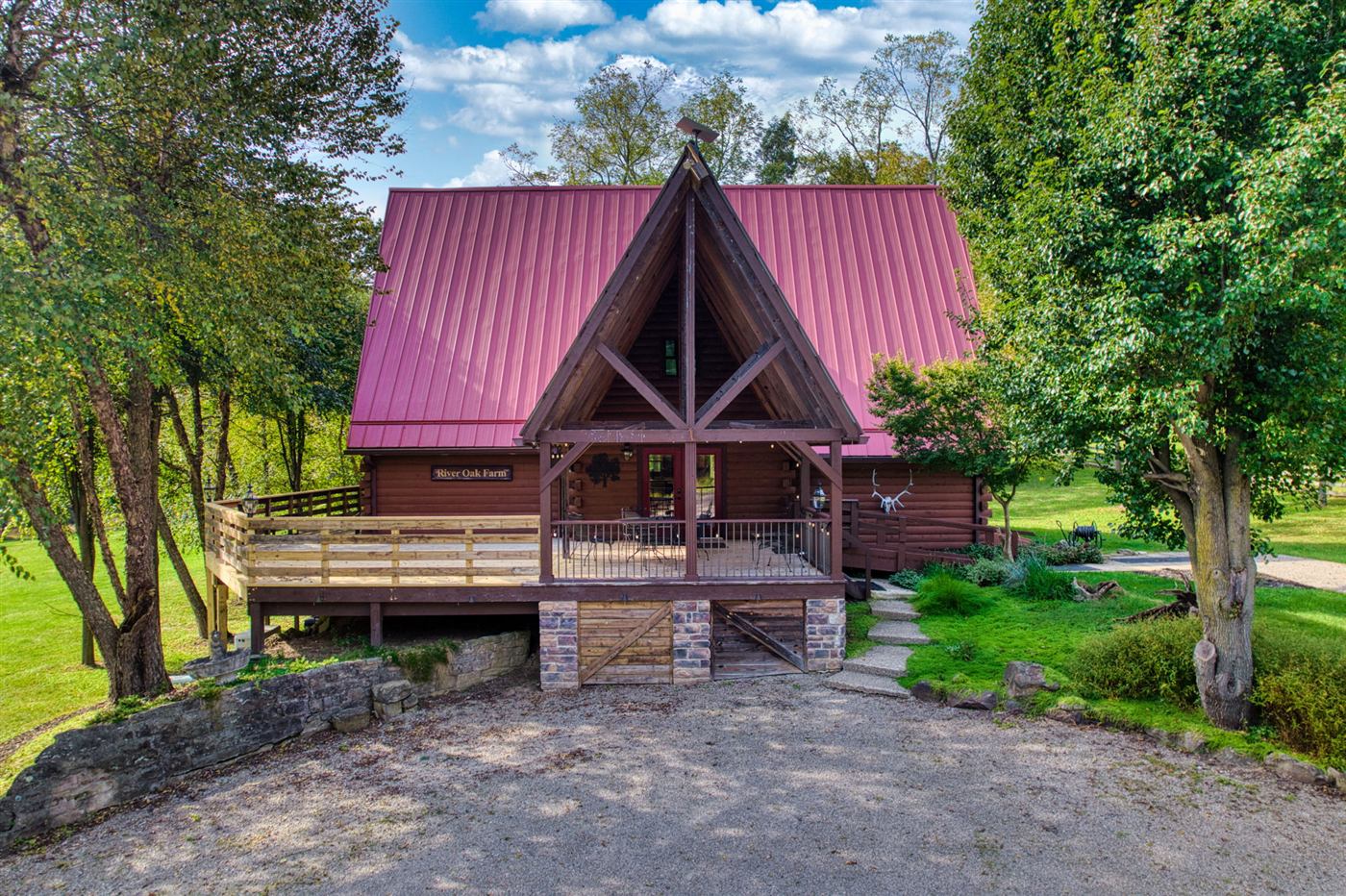 A-frame log home with wraparound deck