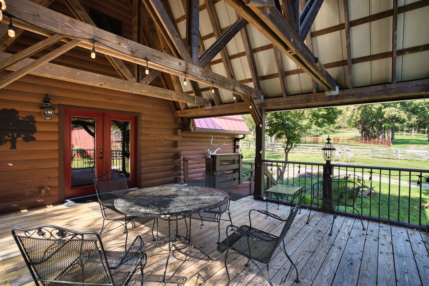 Covered timber pavilion with patio furniture